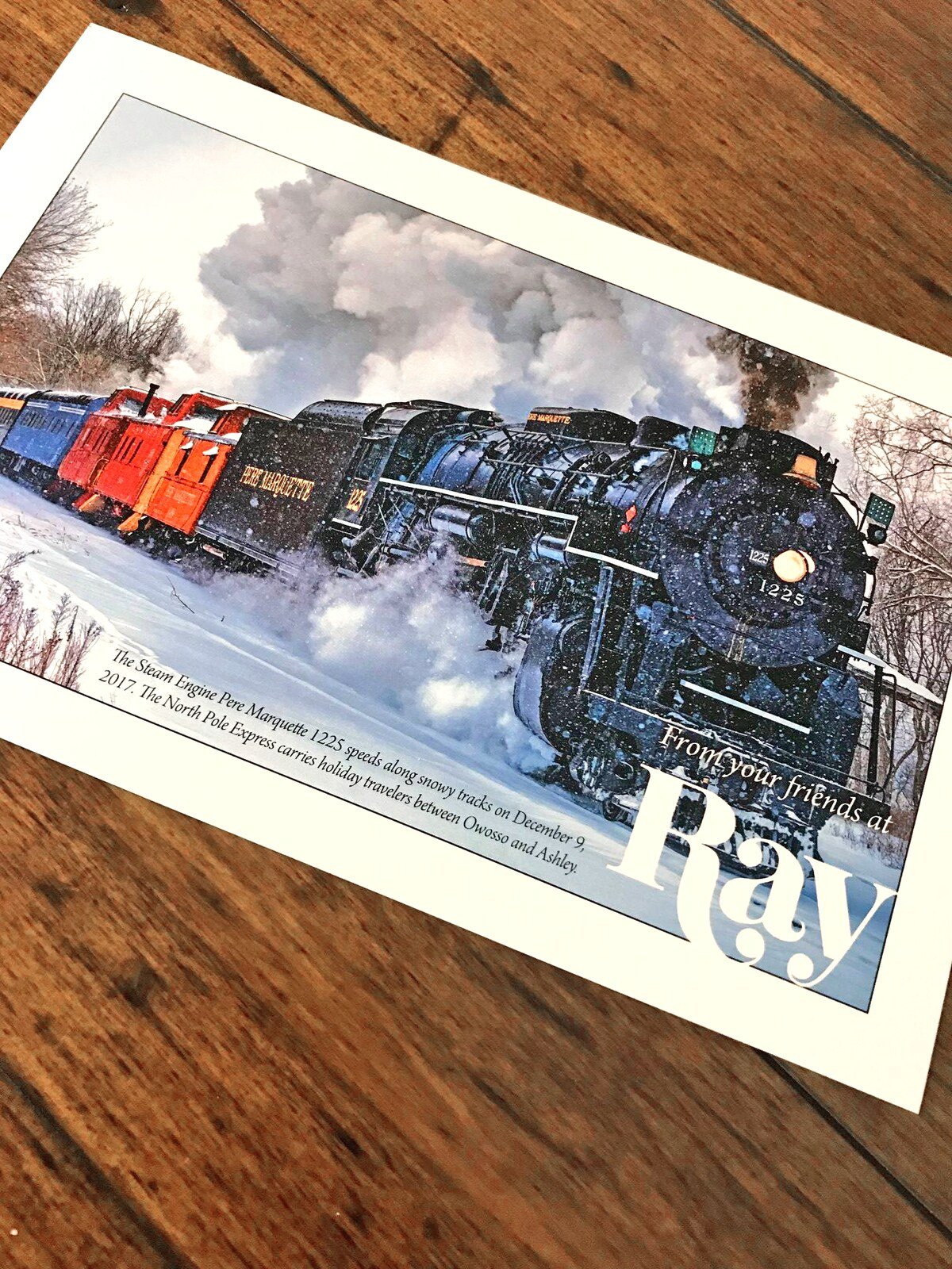 Ray Printing Company postcard with train imagery